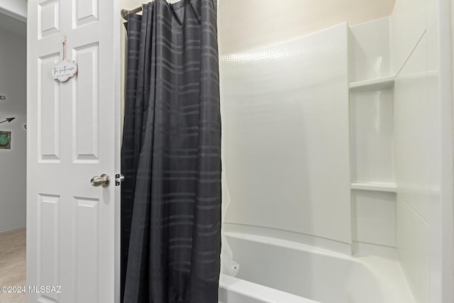 full bathroom featuring shower / bathtub combination with curtain