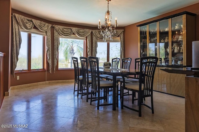 5310 N Calle Bujia, Tucson, AZ 85718 - dining area featuring a chandelier and baseboards