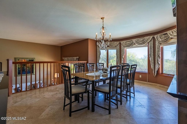 5310 N Calle Bujia, Tucson, AZ 85718 - dining space with a chandelier, stone finish floors, and baseboards