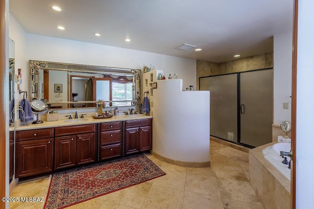 5310 N Calle Bujia, Tucson, AZ 85718 - full bathroom with double vanity, a stall shower, a garden tub, and recessed lighting
