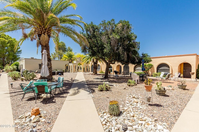 view of community with a patio