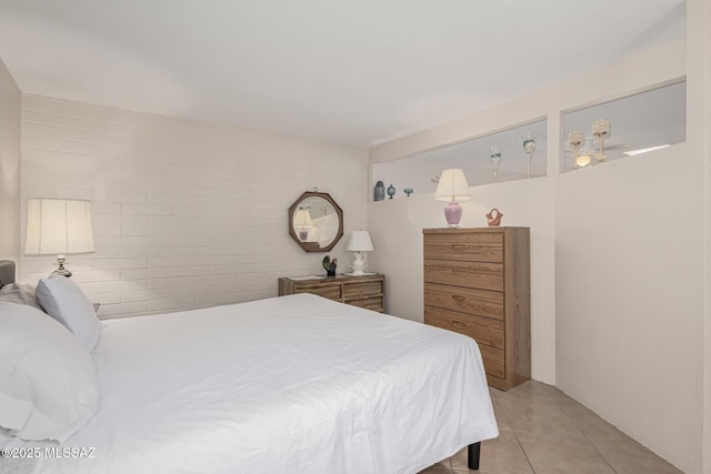 bedroom with light tile patterned flooring