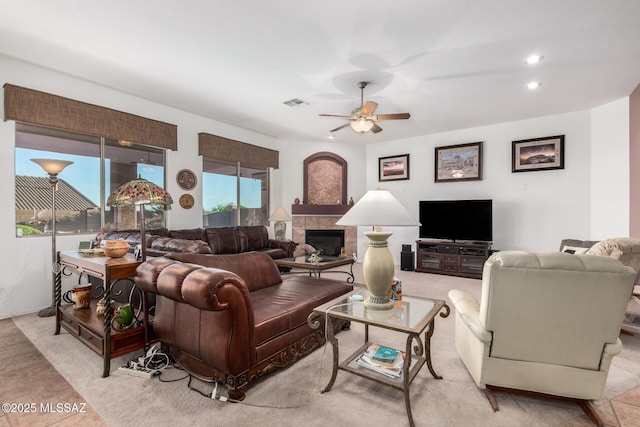 60621 E Eagle Heights Dr, Tucson, AZ 85739 - living area featuring recessed lighting, ceiling fan, visible vents, and a fireplace