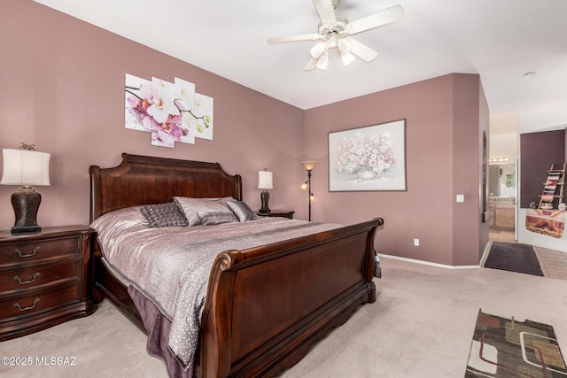60621 E Eagle Heights Dr, Tucson, AZ 85739 - bedroom with light colored carpet, a ceiling fan, baseboards, and ensuite bathroom