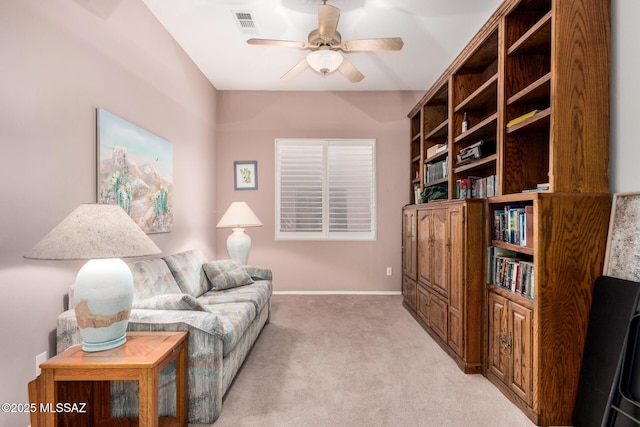 60621 E Eagle Heights Dr, Tucson, AZ 85739 - living room with a ceiling fan, baseboards, light colored carpet, and visible vents