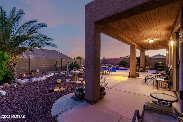 60621 E Eagle Heights Dr, Tucson, AZ 85739 - view of patio / terrace with outdoor dining area and a fenced backyard