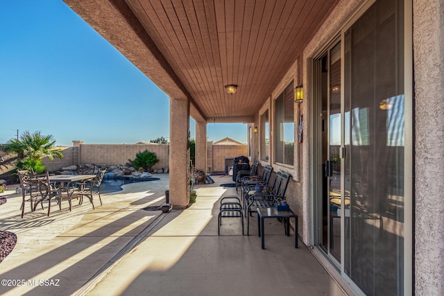 60621 E Eagle Heights Dr, Tucson, AZ 85739 - view of patio / terrace with outdoor dining area and a fenced backyard