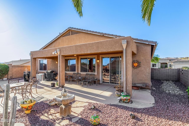60621 E Eagle Heights Dr, Tucson, AZ 85739 - rear view of property with a fenced backyard, stucco siding, and a patio area