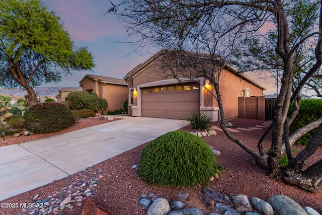 60621 E Eagle Heights Dr, Tucson, AZ 85739 - single story home with an attached garage, stucco siding, fence, and concrete driveway