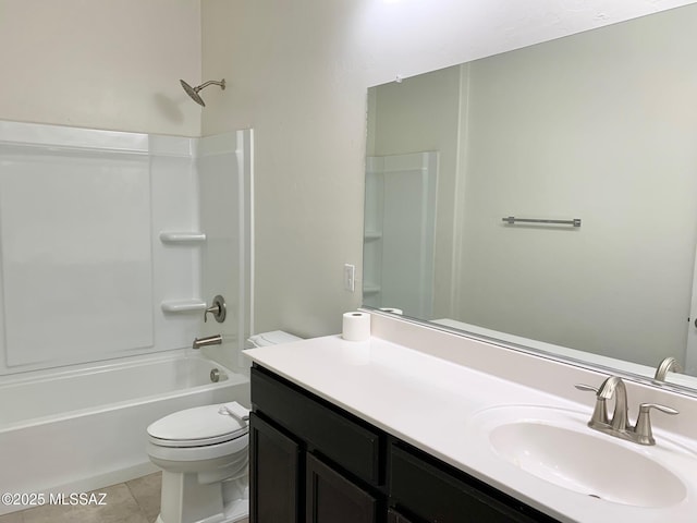 full bathroom featuring toilet, tile patterned floors, washtub / shower combination, and vanity