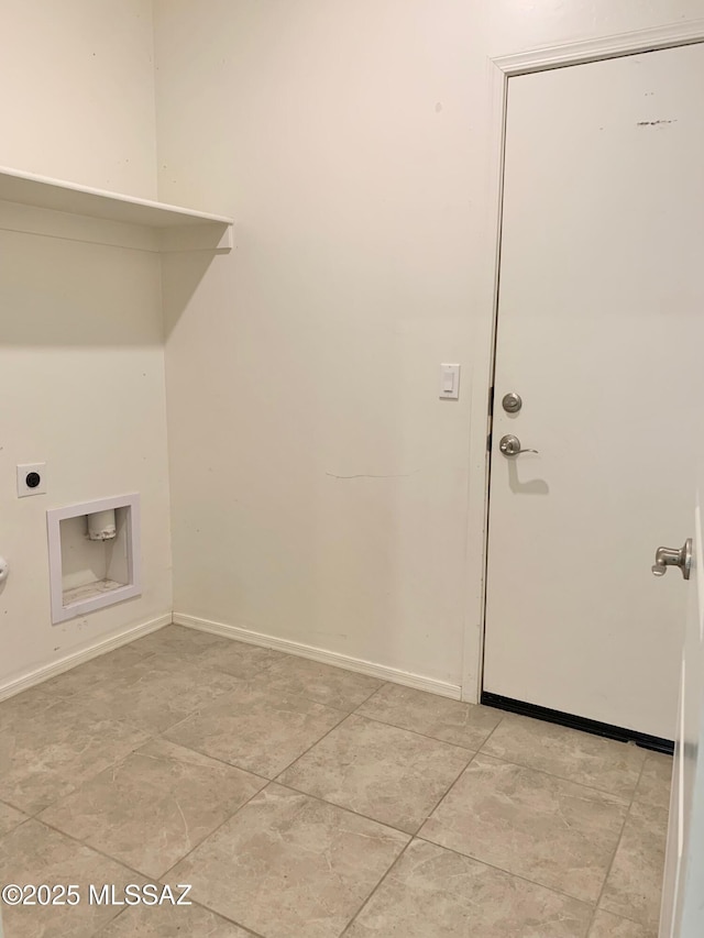laundry area with electric dryer hookup, light tile patterned floors, laundry area, and baseboards