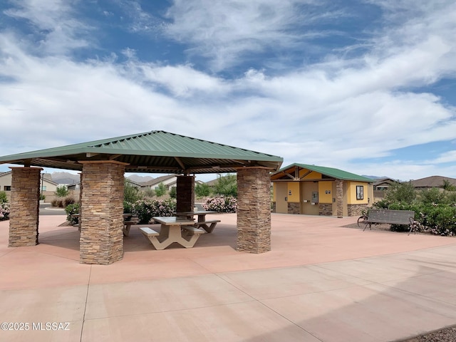 view of property's community with a gazebo and a patio area