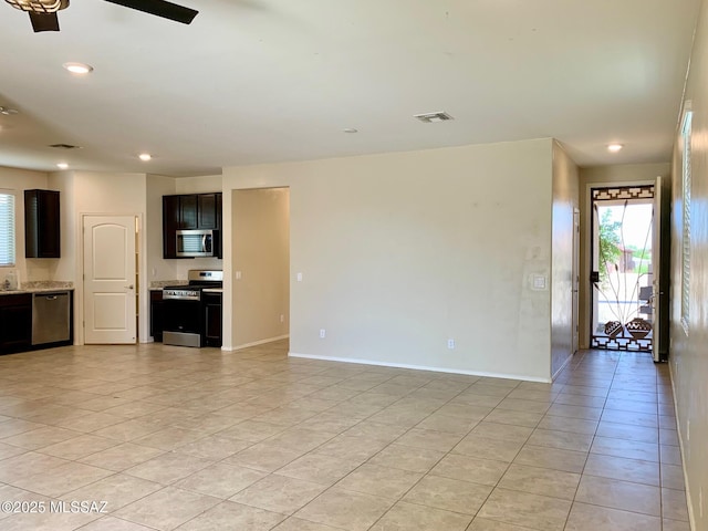 unfurnished living room featuring visible vents, ceiling fan, baseboards, light tile patterned flooring, and recessed lighting