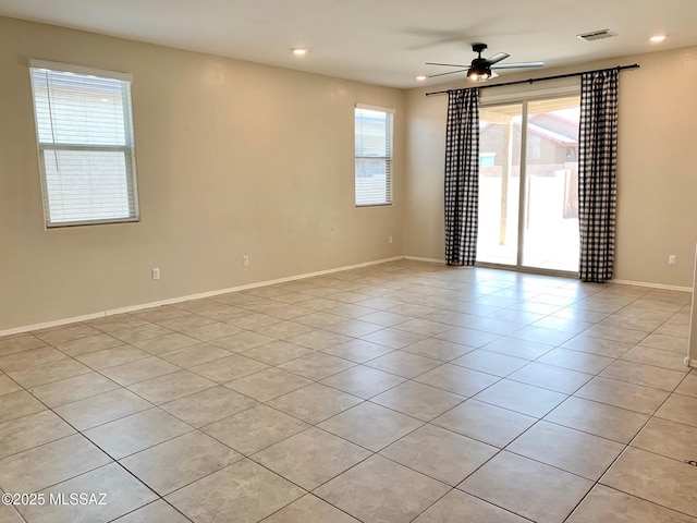 empty room featuring light tile patterned floors, recessed lighting, visible vents, and ceiling fan