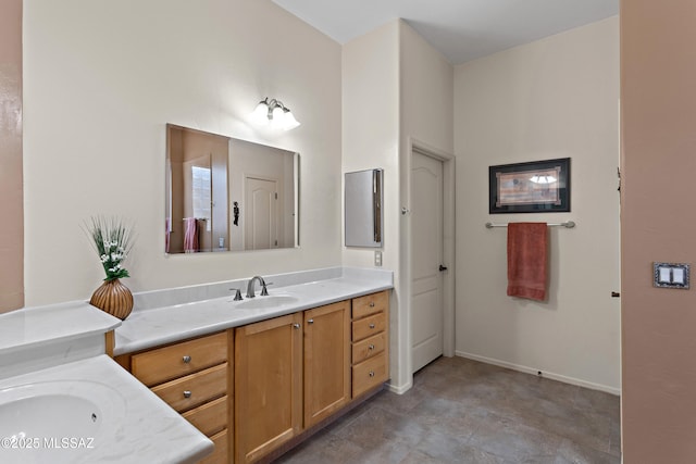 full bathroom featuring baseboards and vanity
