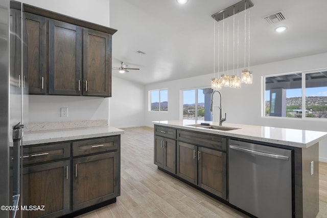 172 Vereda Cabrilla Ln, Rio Rico, AZ 85648 - kitchen featuring stainless steel dishwasher, light wood-style flooring, dark brown cabinets, a sink, and a ceiling fan
