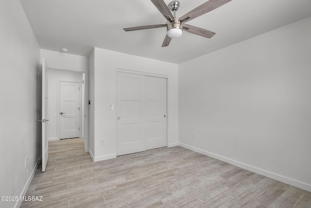172 Vereda Cabrilla Ln, Rio Rico, AZ 85648 - unfurnished bedroom featuring light wood-style floors, baseboards, and a closet