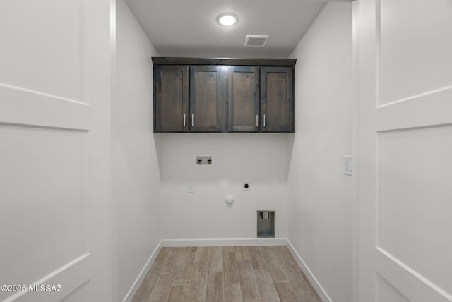 172 Vereda Cabrilla Ln, Rio Rico, AZ 85648 - laundry area with hookup for an electric dryer, washer hookup, hookup for a gas dryer, visible vents, and cabinet space