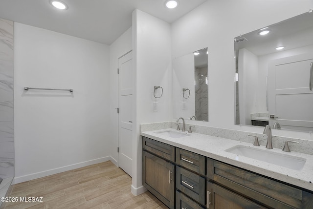 172 Vereda Cabrilla Ln, Rio Rico, AZ 85648 - full bath featuring visible vents, wood finished floors, a marble finish shower, and a sink