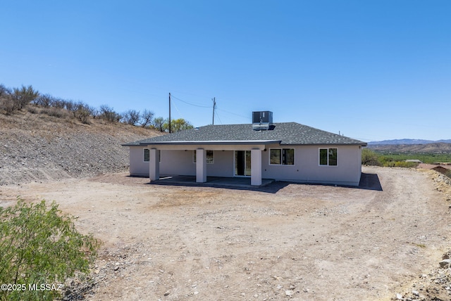 172 Vereda Cabrilla Ln, Rio Rico, AZ 85648 - view of front of property with central AC, a shingled roof, and a patio area