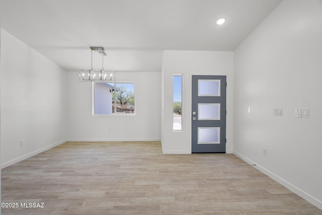 172 Vereda Cabrilla Ln, Rio Rico, AZ 85648 - foyer entrance with baseboards, recessed lighting, a notable chandelier, and light wood-style flooring