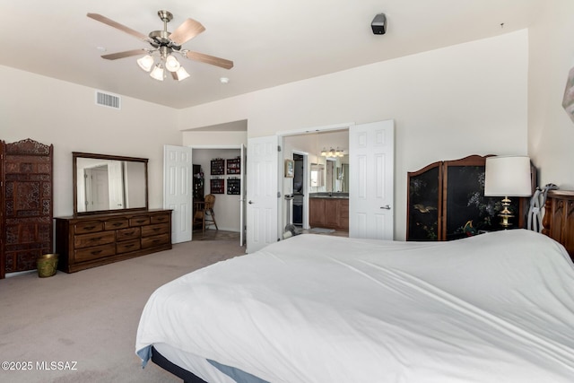 5498 N Desert Wood Pl, Tucson, AZ 85745 - bedroom with ensuite bathroom, light carpet, a ceiling fan, and visible vents