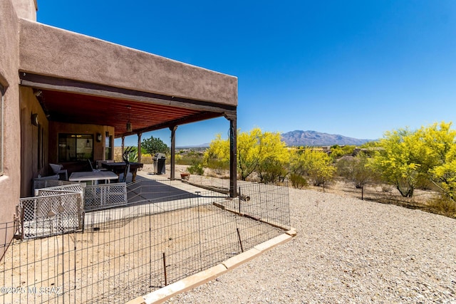 5498 N Desert Wood Pl, Tucson, AZ 85745 - view of patio with fence and a mountain view