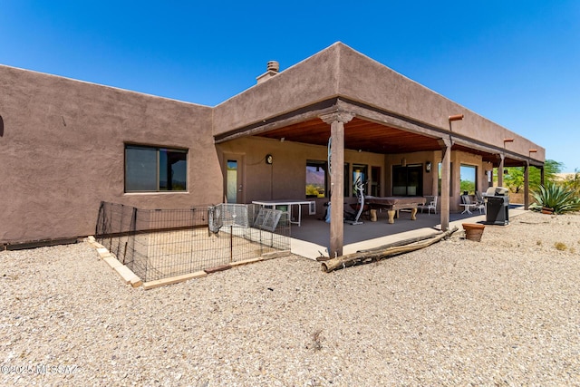 5498 N Desert Wood Pl, Tucson, AZ 85745 - back of property with a patio area and stucco siding