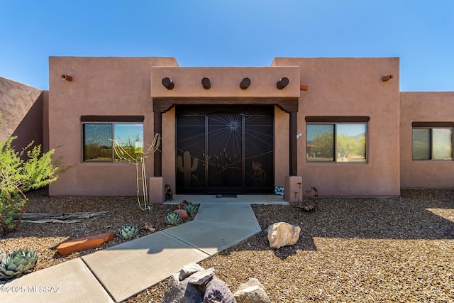 5498 N Desert Wood Pl, Tucson, AZ 85745 - entrance to property with stucco siding and a garage
