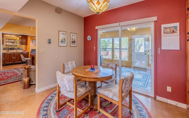 dining area featuring baseboards