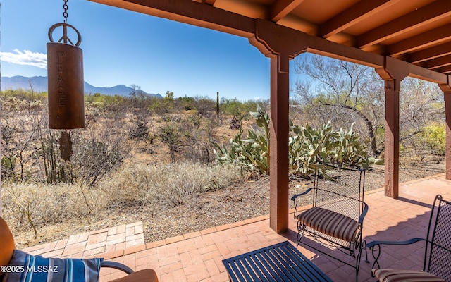 view of patio / terrace with a mountain view