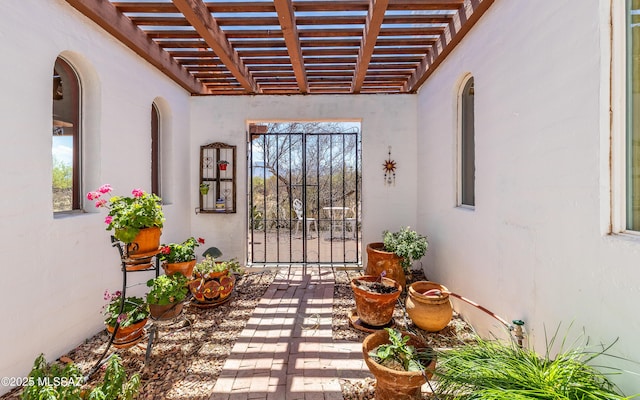 entrance to property with a pergola