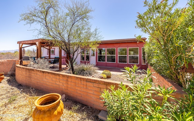 rear view of property with a patio area