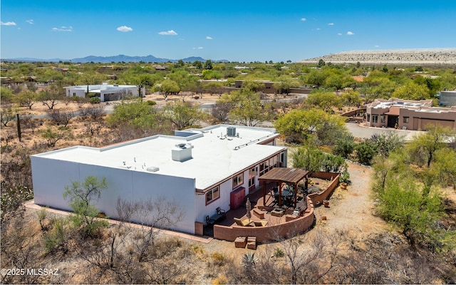 birds eye view of property featuring a mountain view