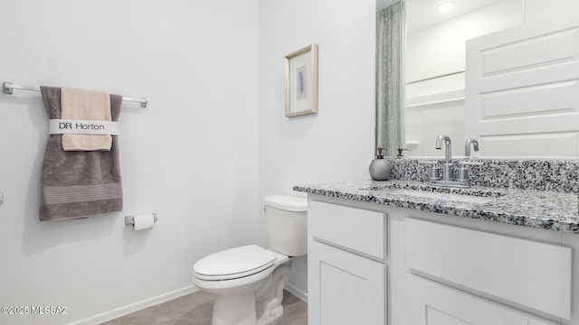 9828 E Gray Hawk Dr, Tucson, AZ 85730 - bathroom featuring baseboards, toilet, tile patterned flooring, and vanity