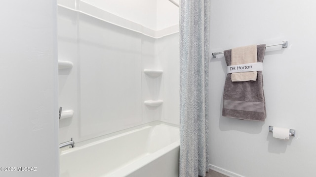 9828 E Gray Hawk Dr, Tucson, AZ 85730 - full bathroom featuring shower / tub combo with curtain and baseboards