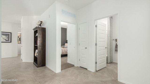 9828 E Gray Hawk Dr, Tucson, AZ 85730 - hall featuring baseboards and light tile patterned floors