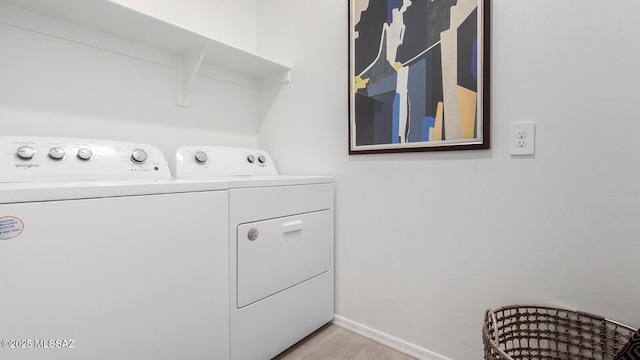 9828 E Gray Hawk Dr, Tucson, AZ 85730 - clothes washing area featuring baseboards, separate washer and dryer, and laundry area