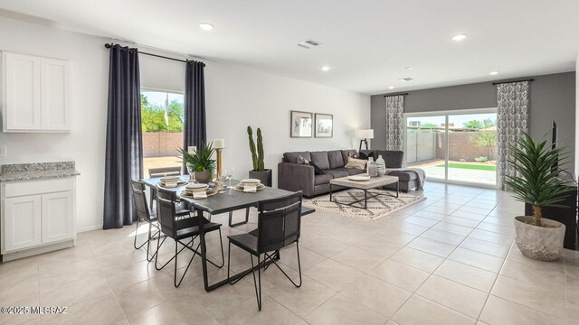 9828 E Gray Hawk Dr, Tucson, AZ 85730 - dining space featuring light tile patterned floors, recessed lighting, visible vents, and a healthy amount of sunlight