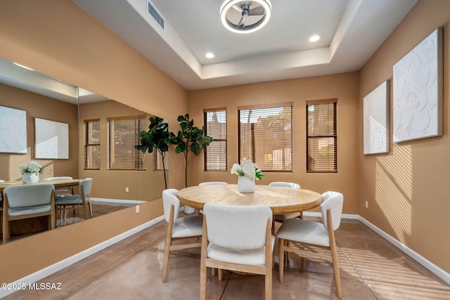 6340 N Placita Alta Reposa, Tucson, AZ 85750 - dining area featuring finished concrete flooring, visible vents, a tray ceiling, baseboards, and recessed lighting