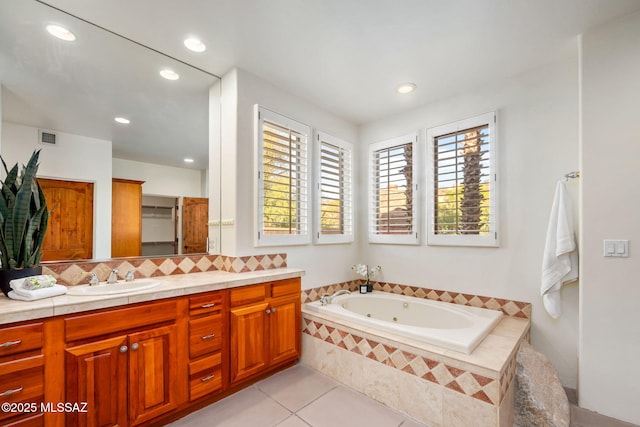 6340 N Placita Alta Reposa, Tucson, AZ 85750 - bathroom featuring tile patterned flooring, a whirlpool tub, decorative backsplash, vanity, and visible vents