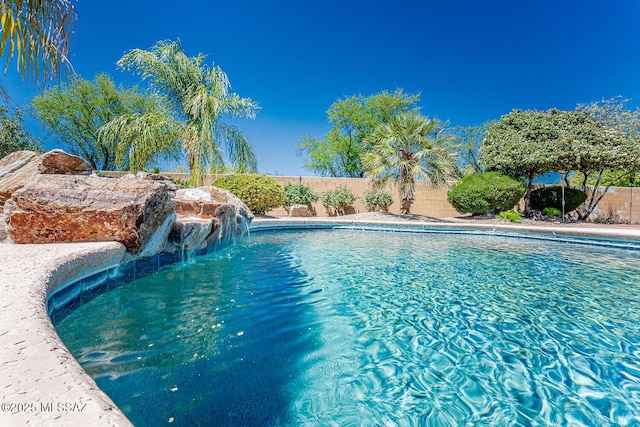 view of swimming pool with a fenced in pool and a fenced backyard