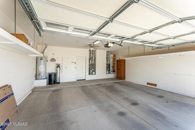 garage featuring water heater and a garage door opener