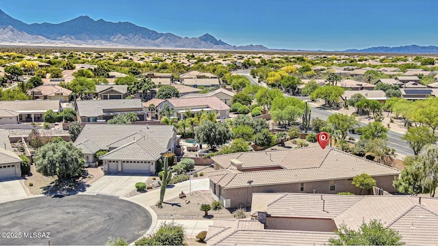 drone / aerial view with a mountain view and a residential view