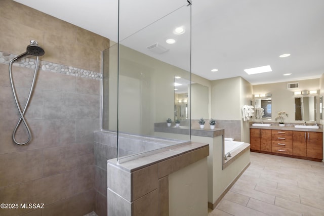 full bath featuring a walk in shower, double vanity, recessed lighting, visible vents, and a garden tub