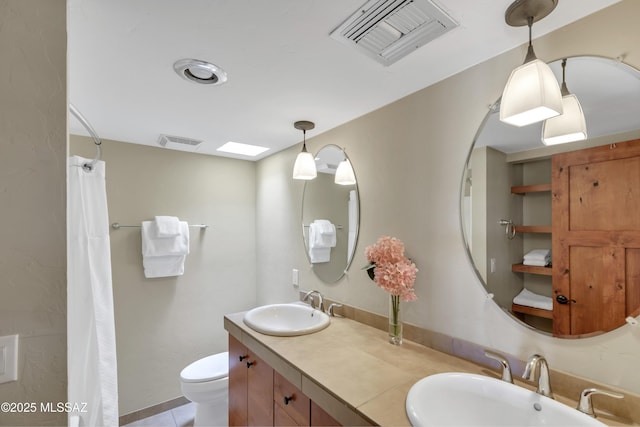 full bathroom with visible vents, a sink, and toilet