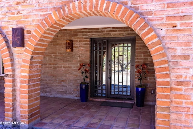 entrance to property with brick siding
