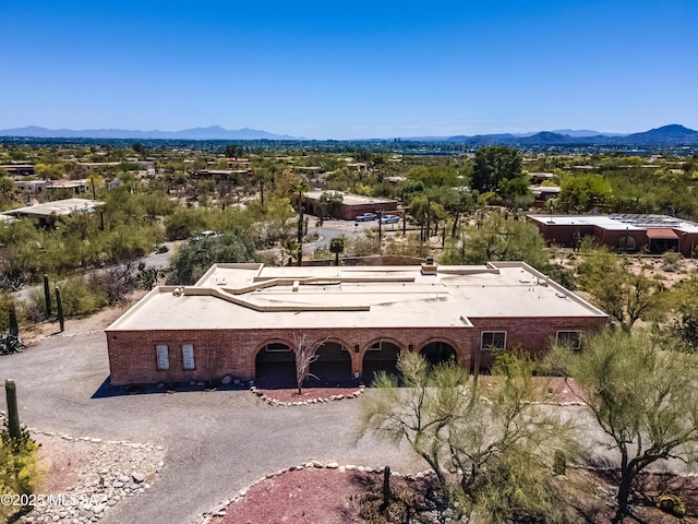 birds eye view of property featuring a mountain view
