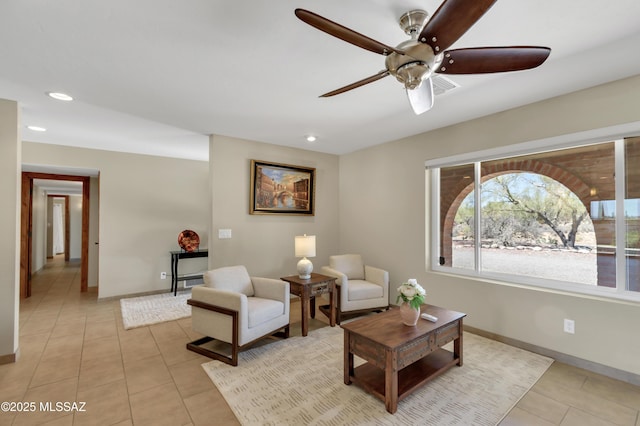 interior space featuring a ceiling fan, baseboards, recessed lighting, and light tile patterned floors