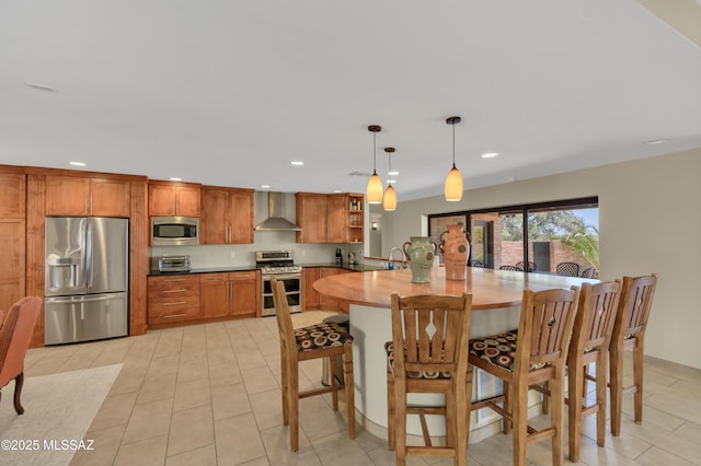 dining space featuring recessed lighting, a toaster, and light tile patterned flooring